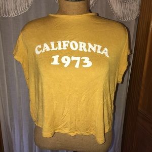 Boho California 1973 yellow cropped tee.